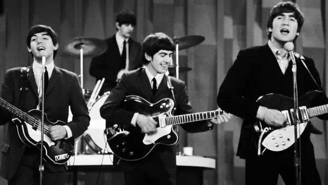 A photo of the Beatles performing on the 'Ed Sullivan Show' on February 9, 1964. Original source: the <em>Austin American-Statesman</em>, www.statesman.com/picture-gallery/news/local/2017/06/02/photos-the-beatles-1964-debut/66948019007/.